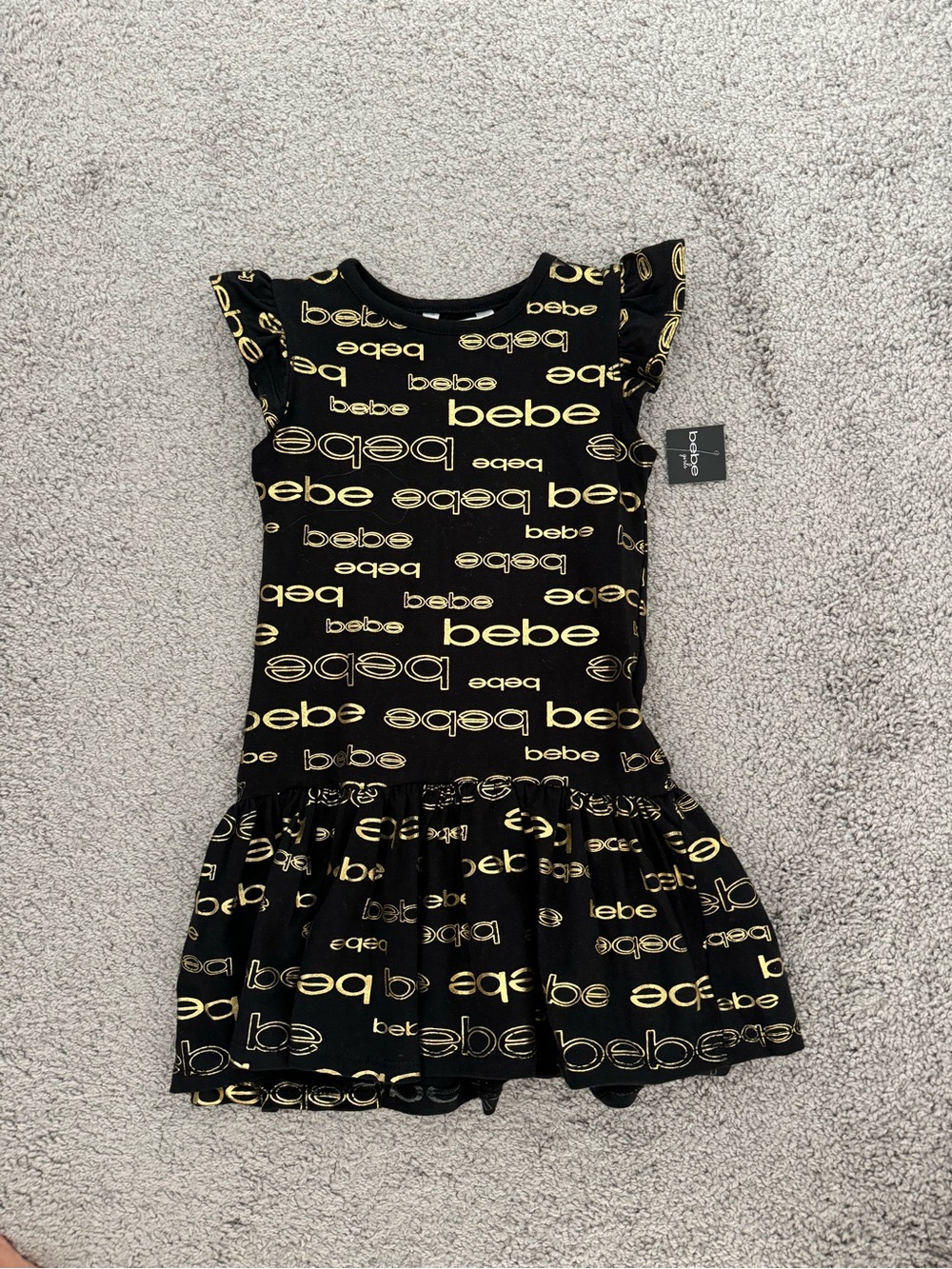bebe Black Dress with Gold Logo Print and Ruffle Skirt